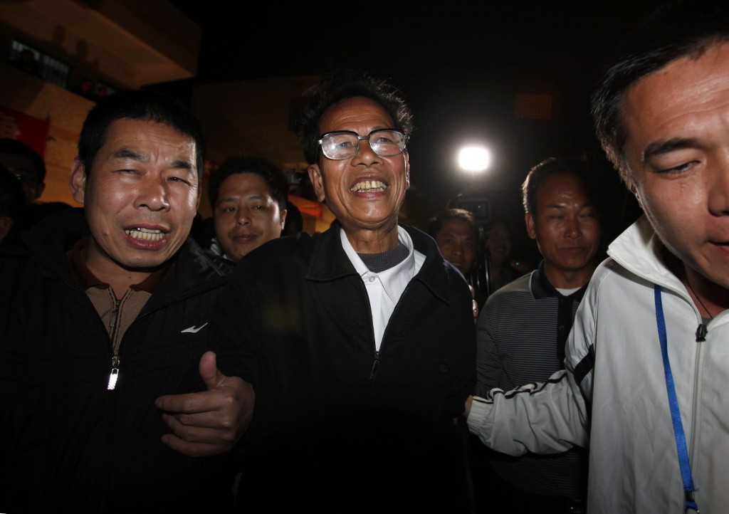 Lin is accompanied by other villagers after being elected as village chief in Wukan
